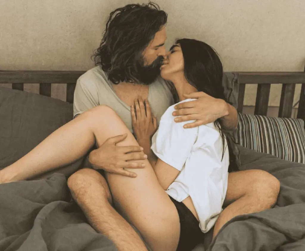 Couple embracing on a bed