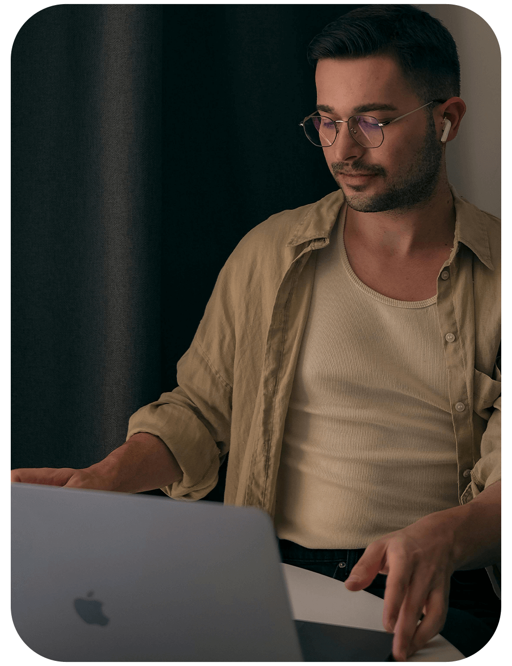 Individual focused on computer work