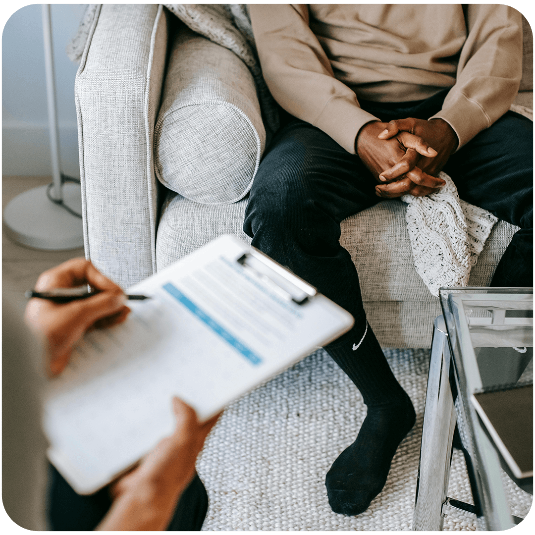 Counseling discussion on a sofa.