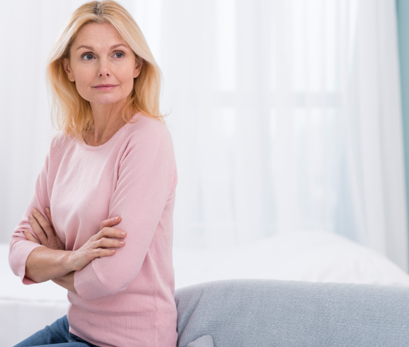 Blonde woman looking away in bright room