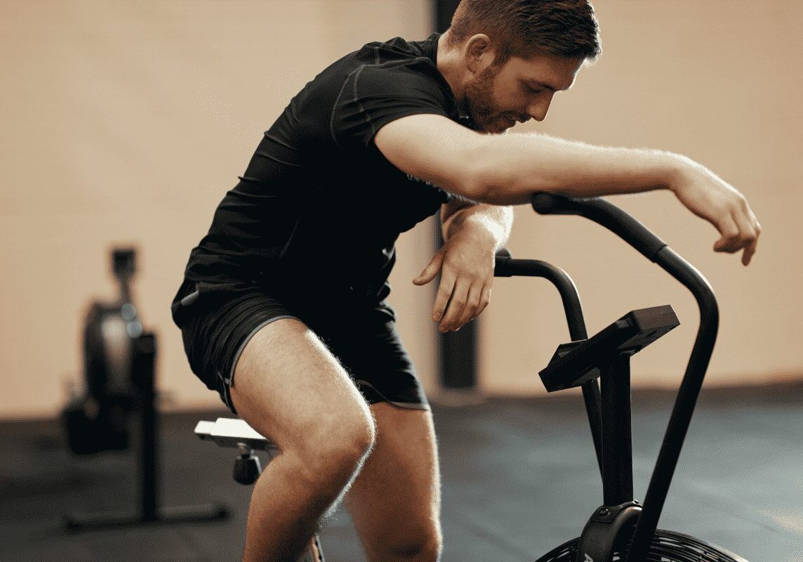 Exhausted cyclist taking a break